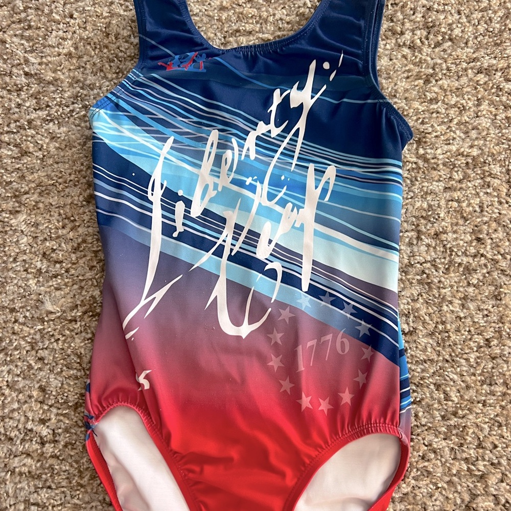 Girl’s GK red, white, blue gymnastics Leo, size youth large.